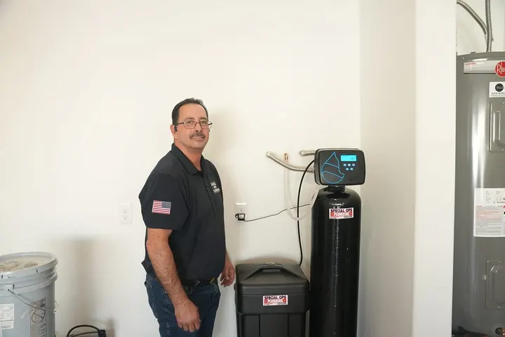 Owner installing a water softener
